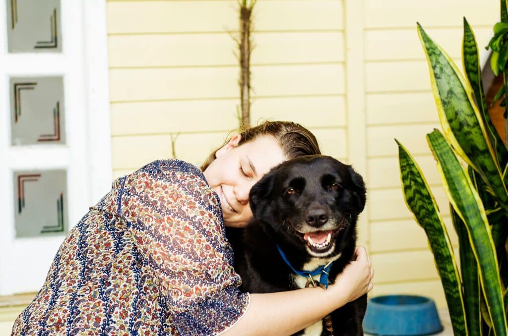 a woman holding her dog