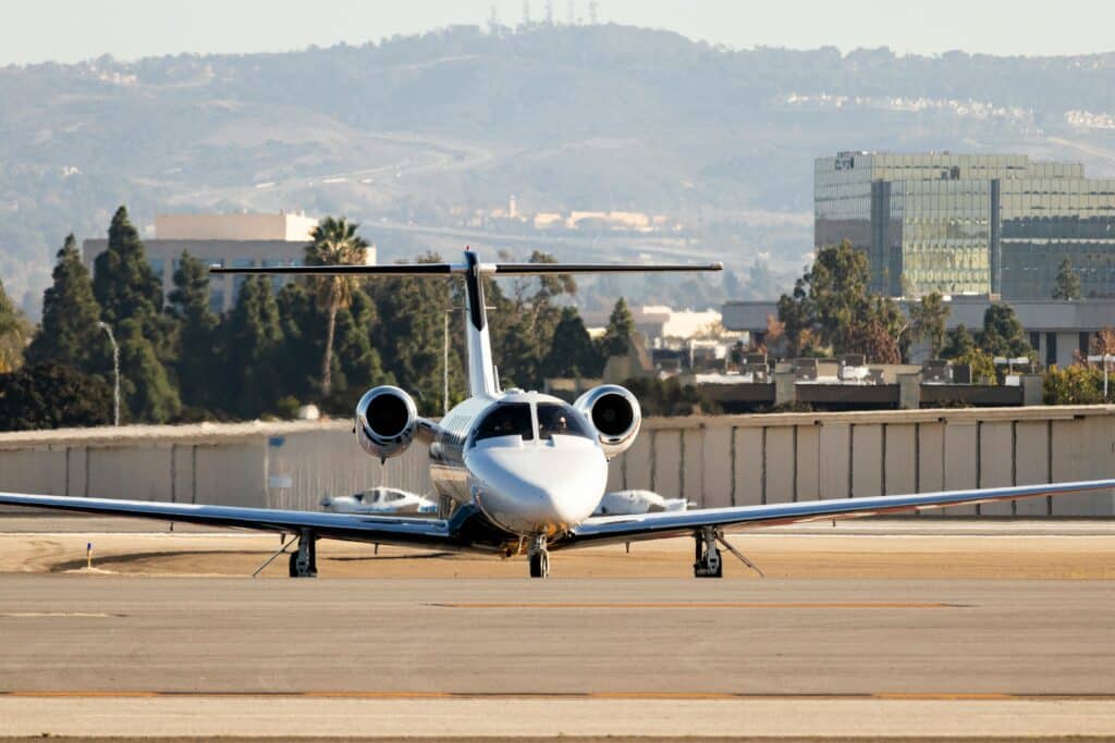 An airplane on a runway in the daytime